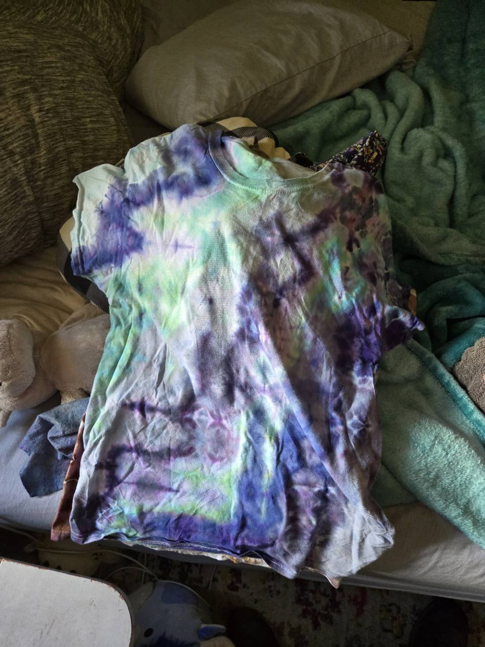 A real Glitch shirt with soft violet and mint washes and broken bands